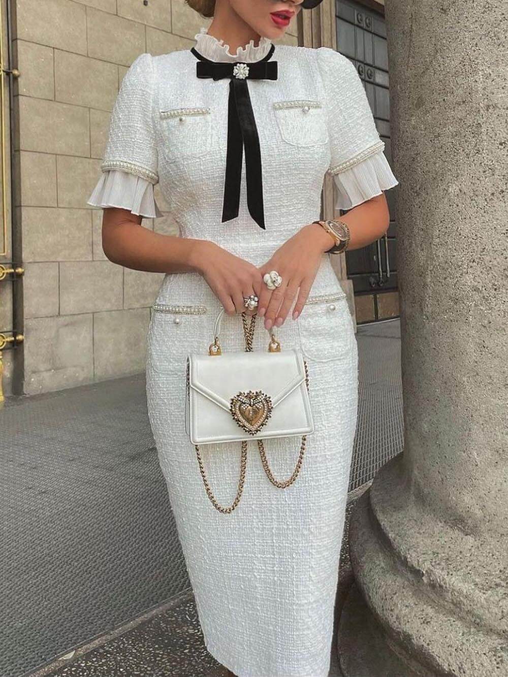 Aerin – Elegante midi jurk van luxe tweed met boogdetail