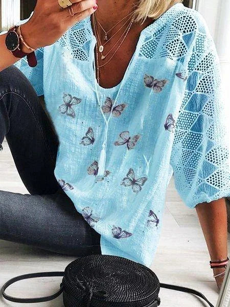Angela – zomer blouse van viscose met knoopdetail aan de mouw