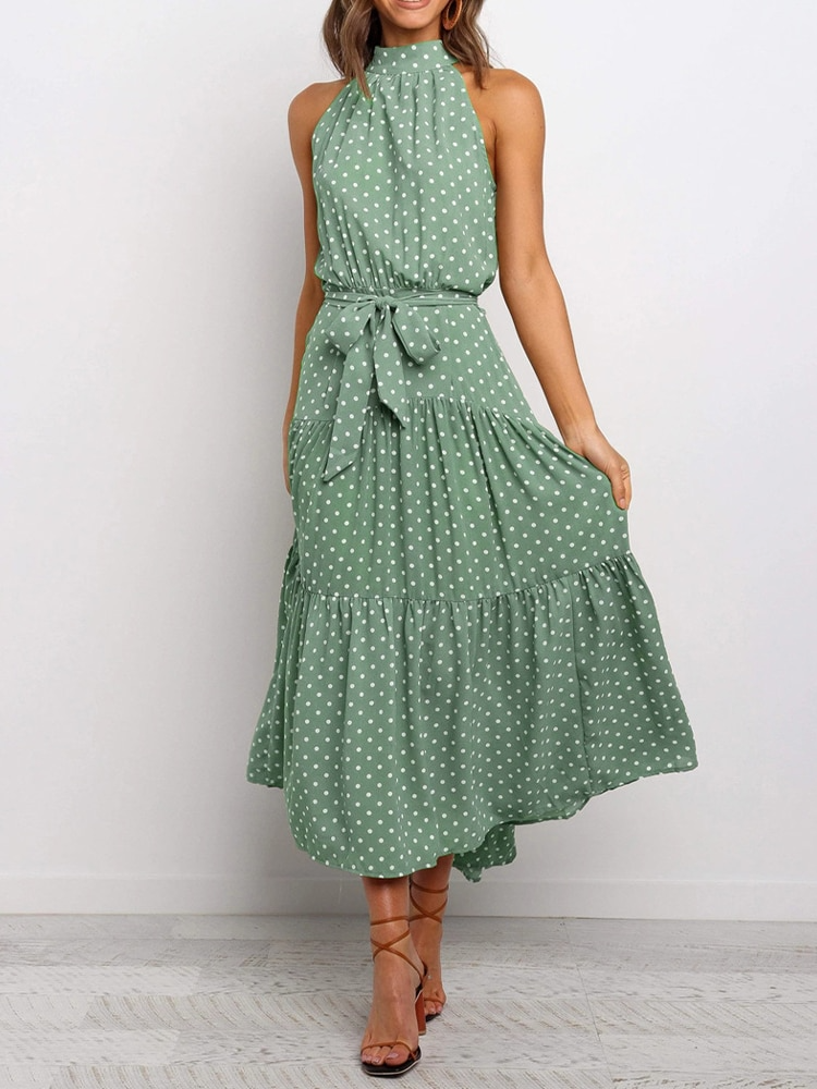 Lola – Zwart-witte halter midi-jurk met polkadots en flatterende tailleceintuur