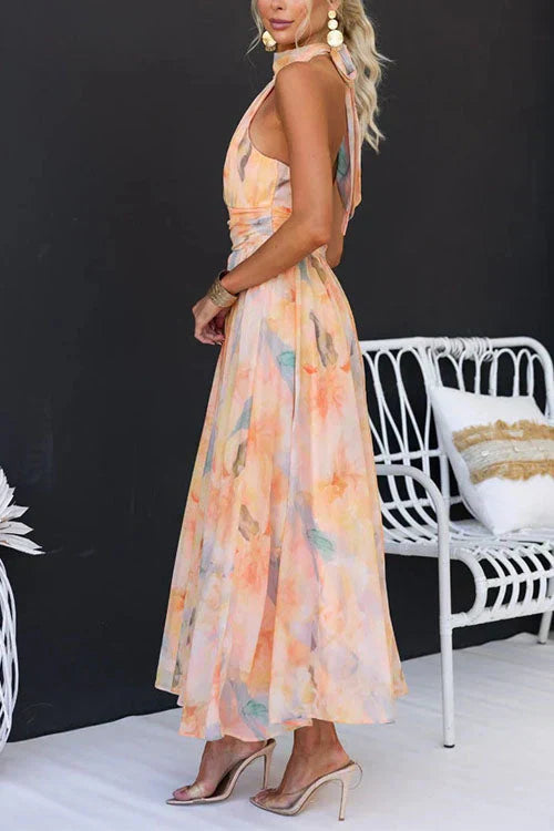 Sandra – Mouwloze Halternek Maxi jurk Met Bloemenprint En Open Rug