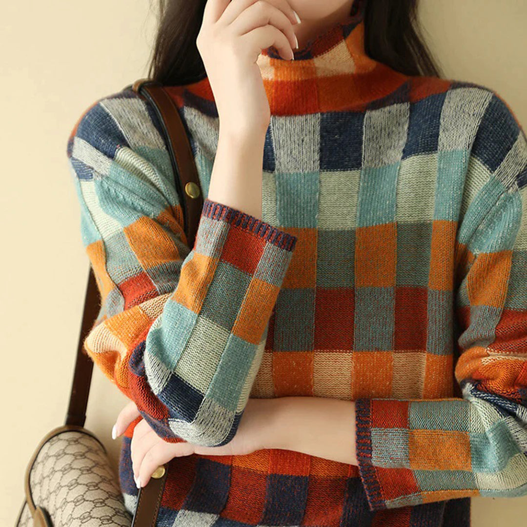 Noëlle – gebreide coltrui met patchworkstructuur en gemêleerde accenten