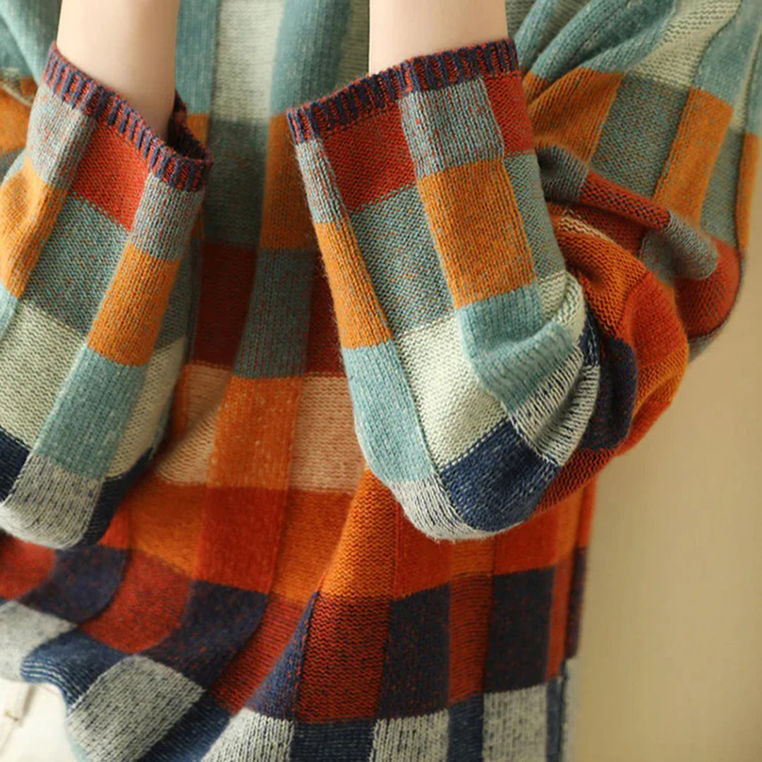 Noëlle – gebreide coltrui met patchworkstructuur en gemêleerde accenten