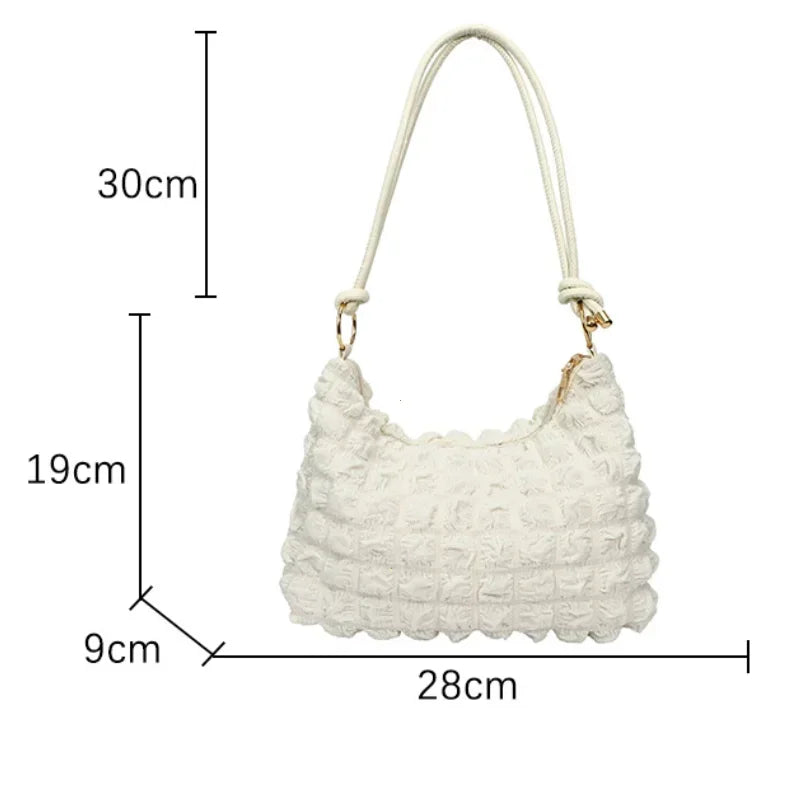 Elena – beige canvas tote met plooien en gewatteerde structuur