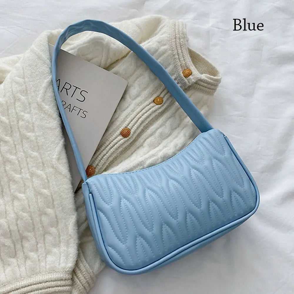 Mila – zwarte pu schoudertas met strak silhouet en verstelbare riem