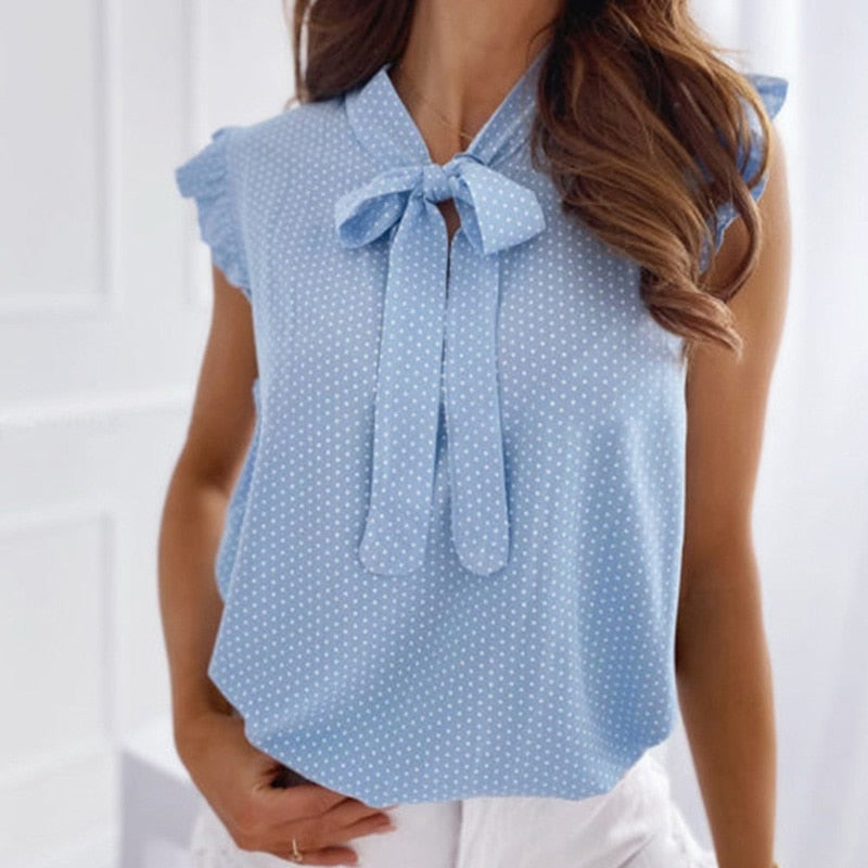 Ria – Zomerse top met ruches mouwen en strikdetail