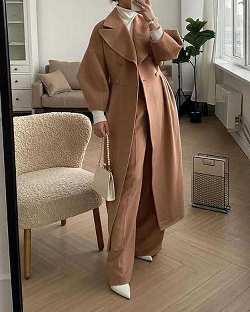 Natalia – lange trenchcoat met lantern mouwen en elegante kraag