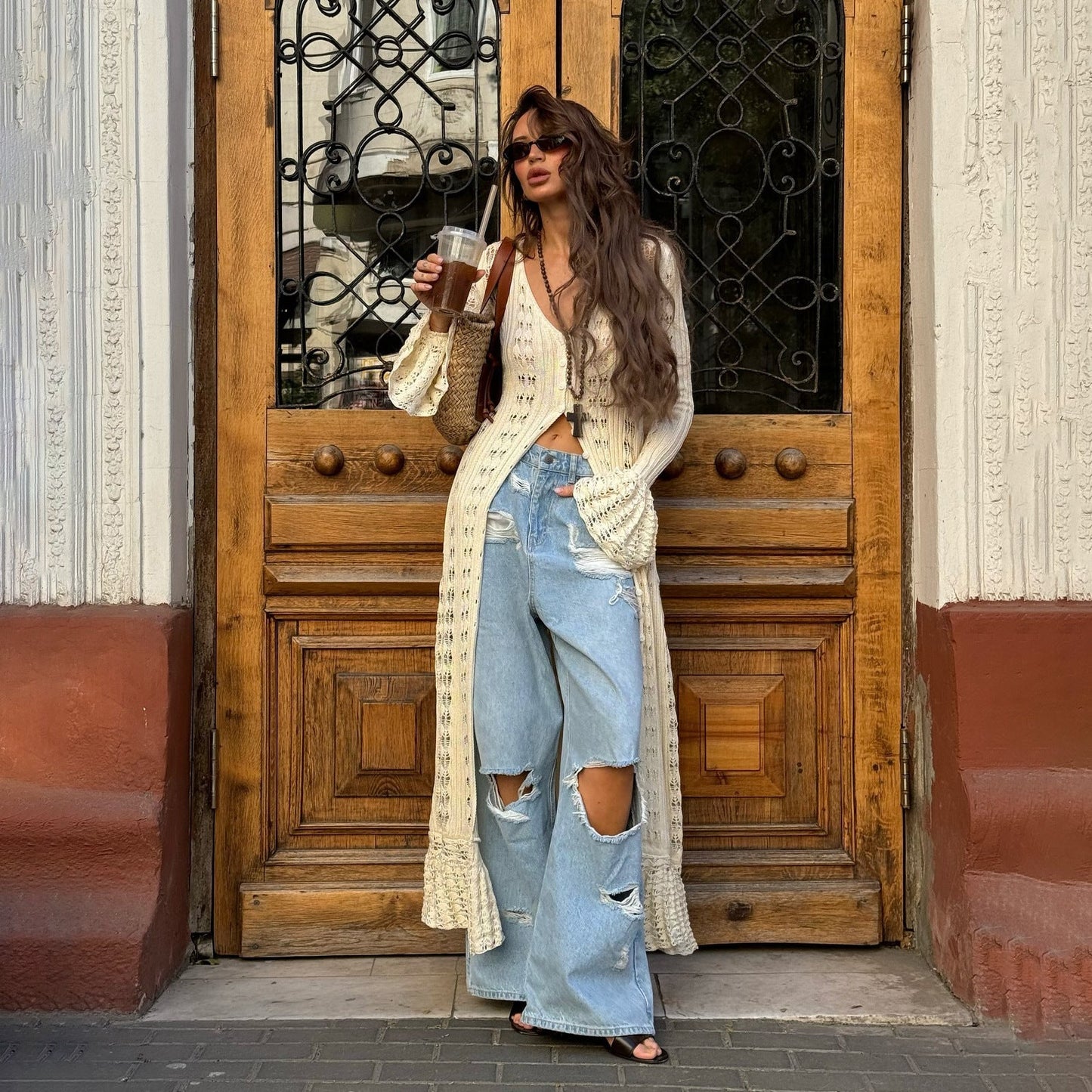 Isabel – lange oversized cardigan-vest met rufflezoom en uitlopende mouwen