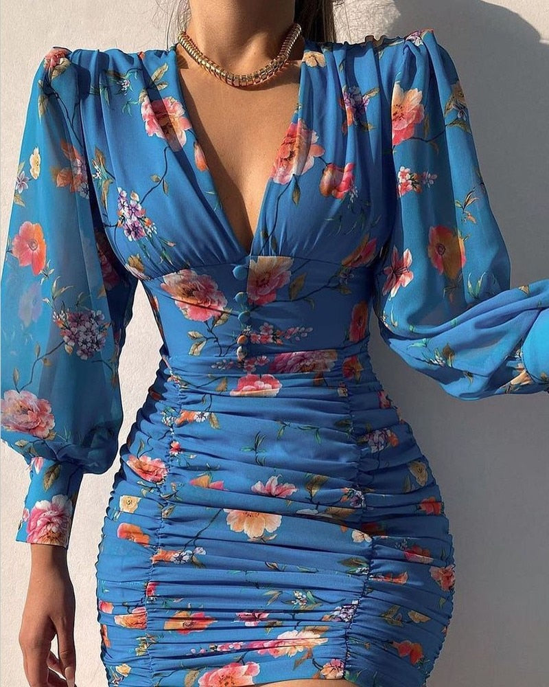 Luna – Mini zomerjurk met V-hals en transparante pofmouwen