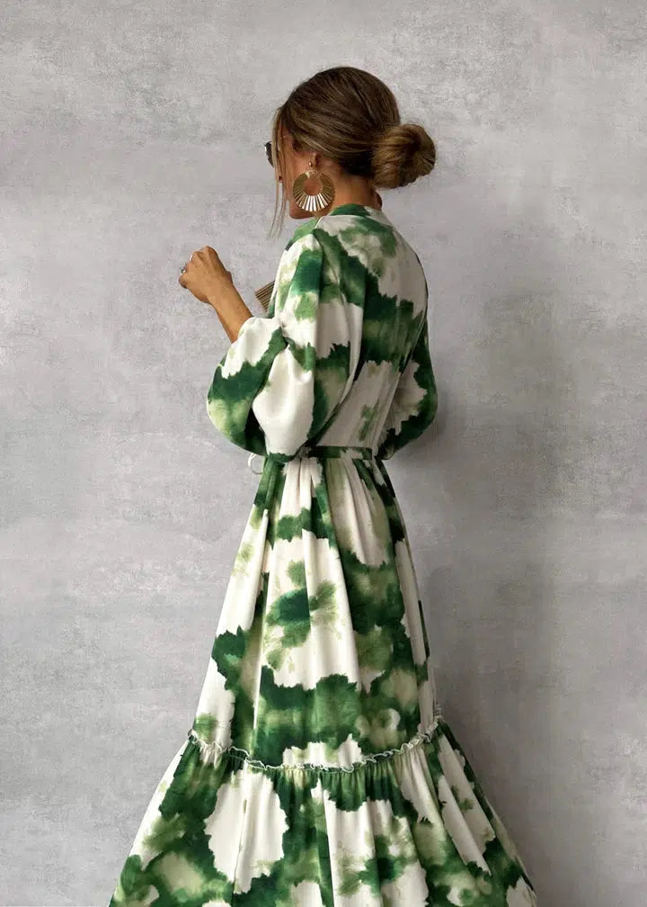 Amara – Terracotta maxi-jurk met etnische print en strikceintuur