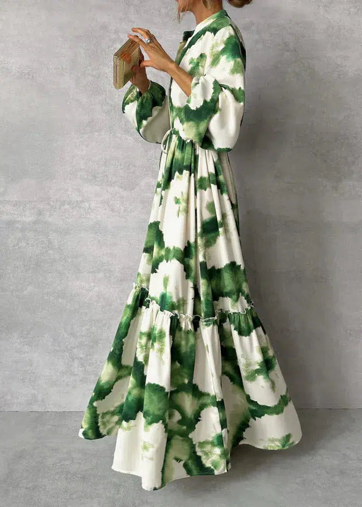 Amara – Terracotta maxi-jurk met etnische print en strikceintuur