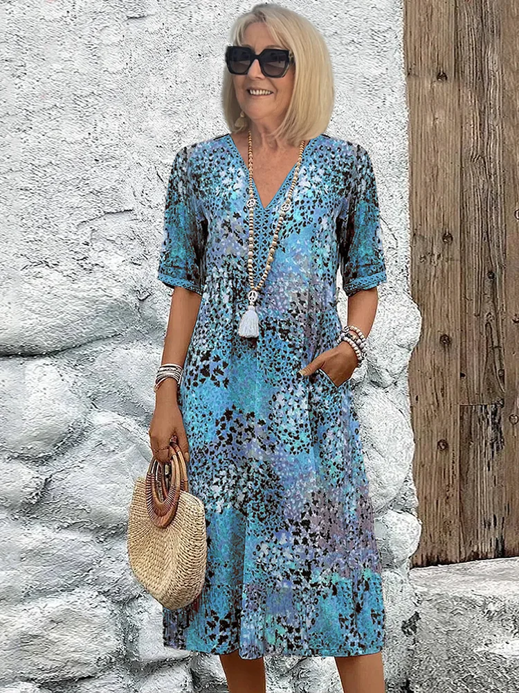 Isla – Midi-jurk met bloemenprint en V-hals