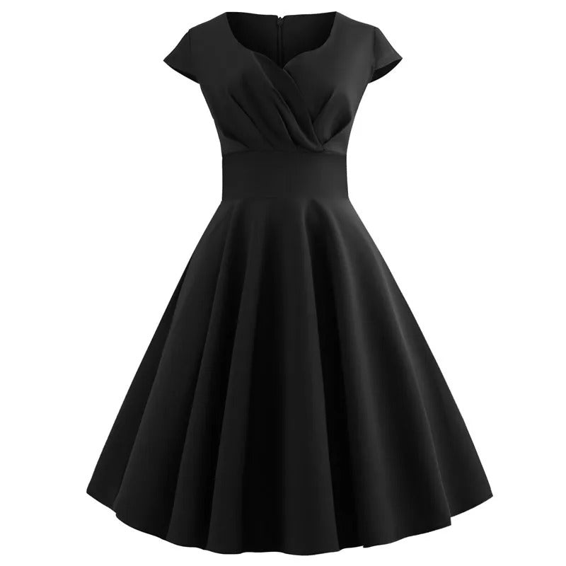 Liora – Koraalroze zomerjurk met V-hals en taille-accent
