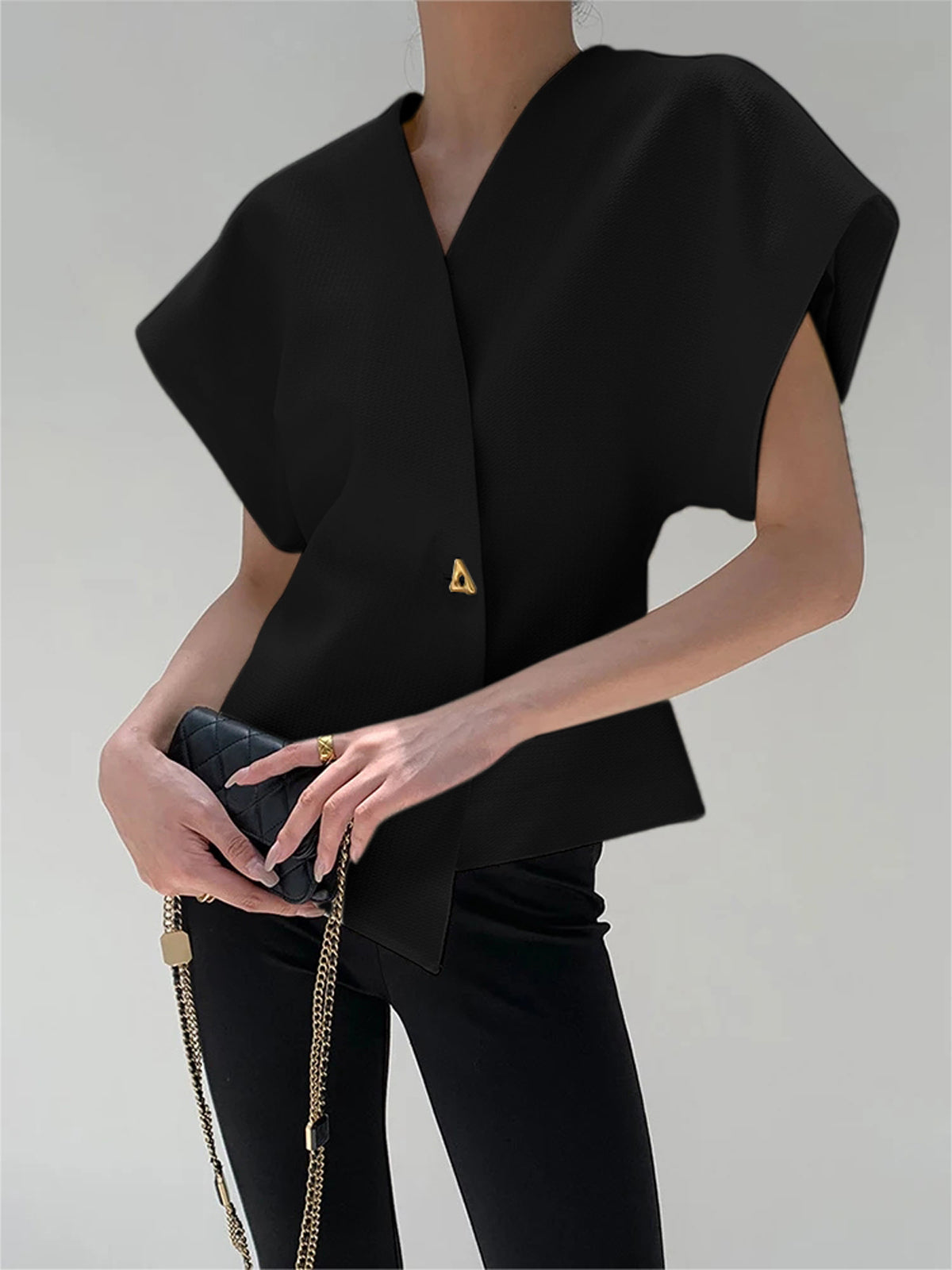 Top met asymmetrische sluiting en korte mouw