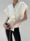 Top met asymmetrische sluiting en korte mouw