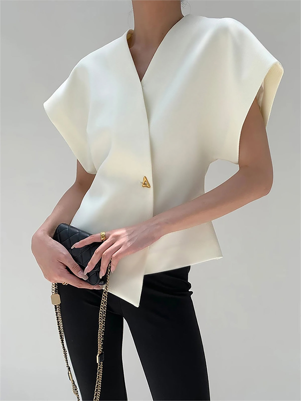 Top met asymmetrische sluiting en korte mouw