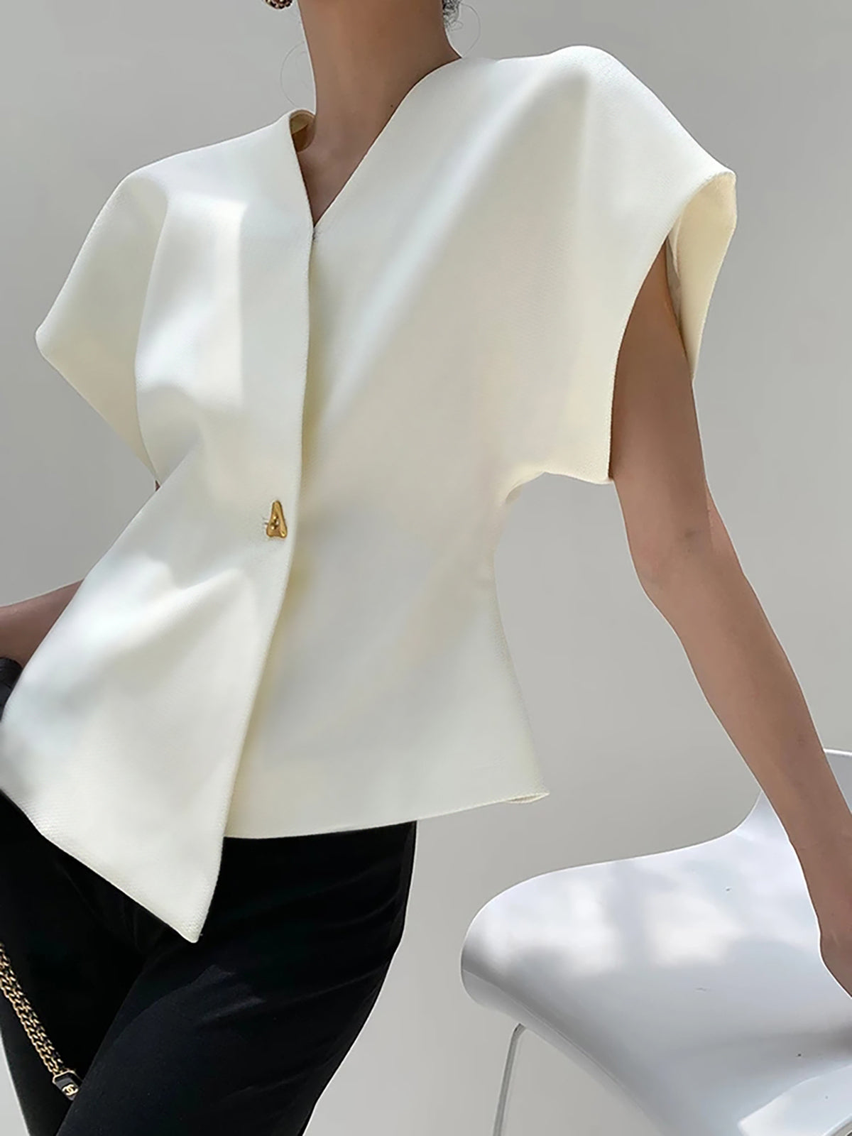 Top met asymmetrische sluiting en korte mouw