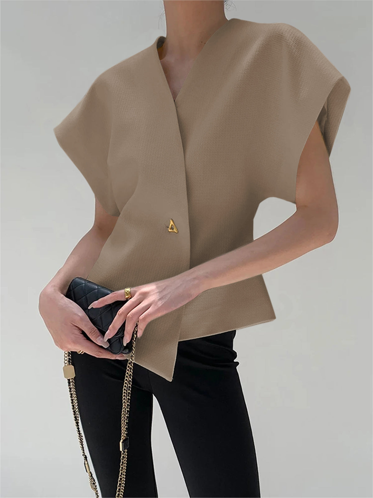 Top met asymmetrische sluiting en korte mouw