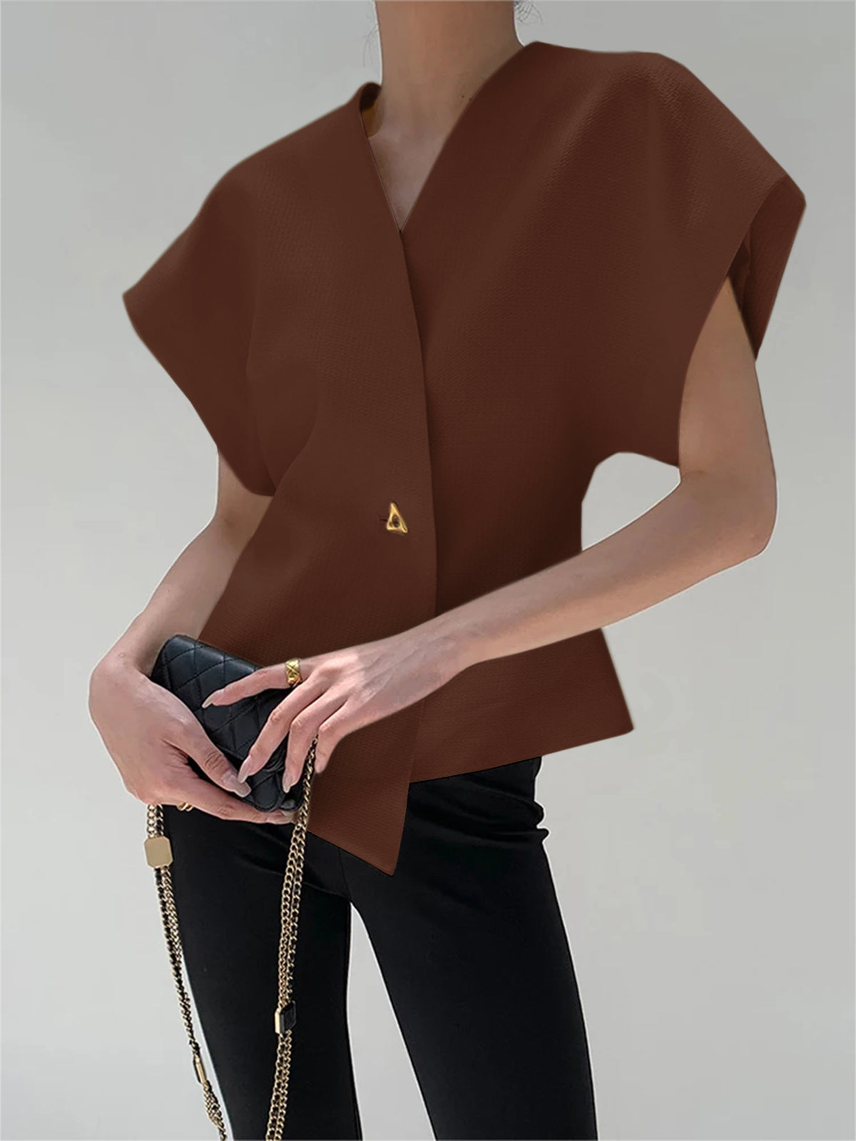 Top met asymmetrische sluiting en korte mouw
