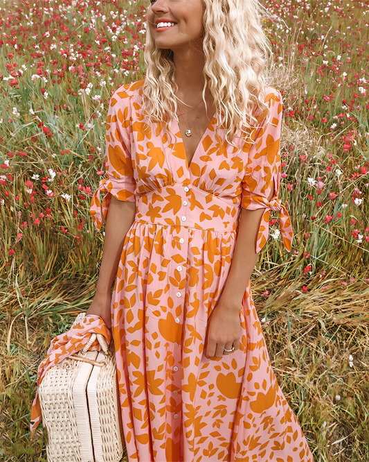 Gigi – Oranje midi jurk met elegant ontwerp en geraffineerde details