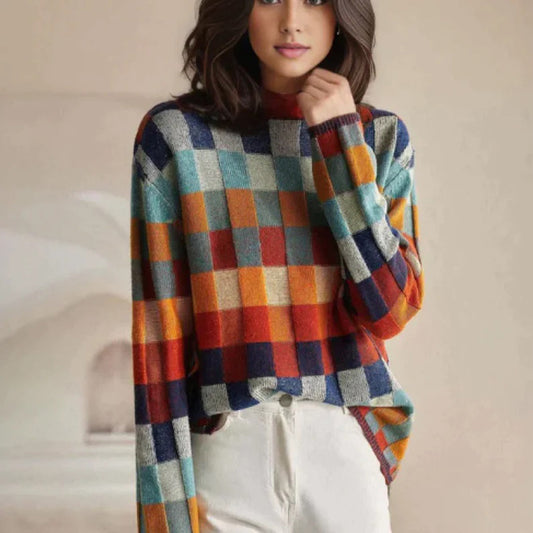Noëlle – gebreide coltrui met patchworkstructuur en gemêleerde accenten
