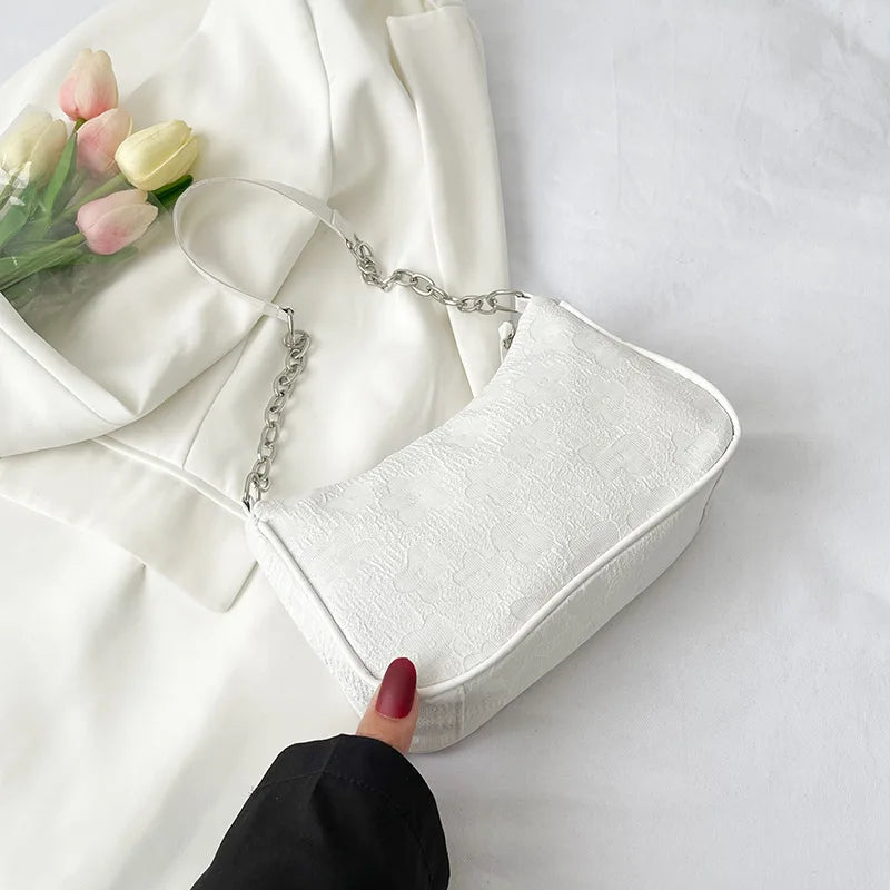 Elisa – handtas met bloemenmotief en vaste handgreep