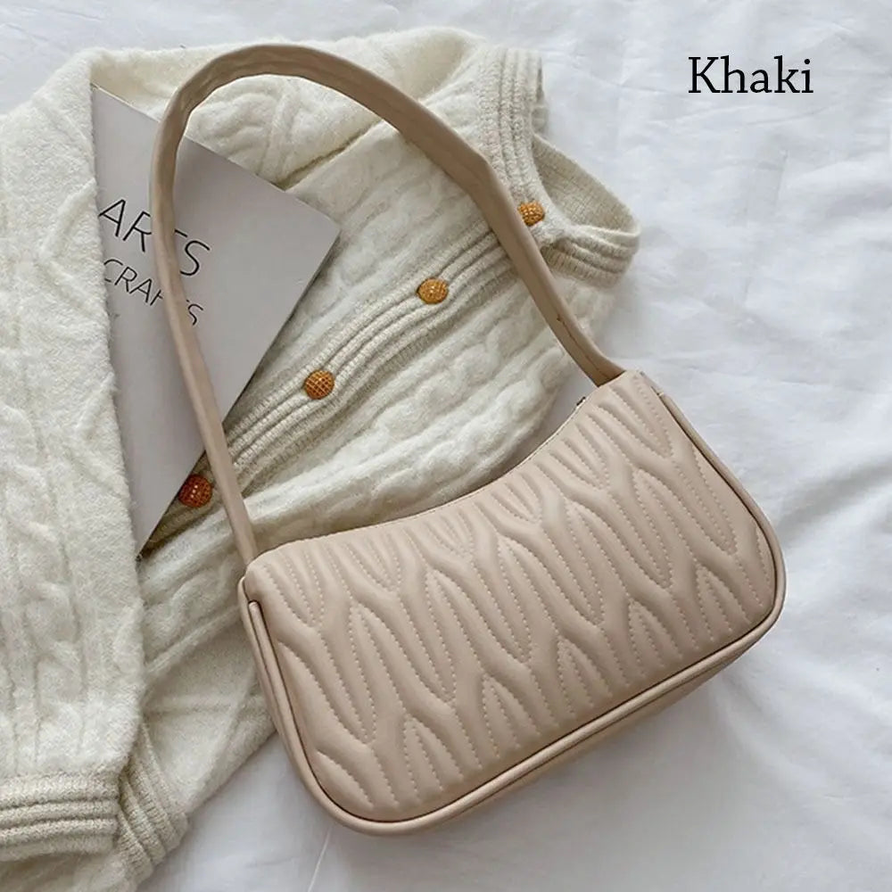 Mila – zwarte pu schoudertas met strak silhouet en verstelbare riem