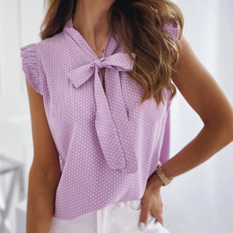 Ria – Zomerse top met ruches mouwen en strikdetail