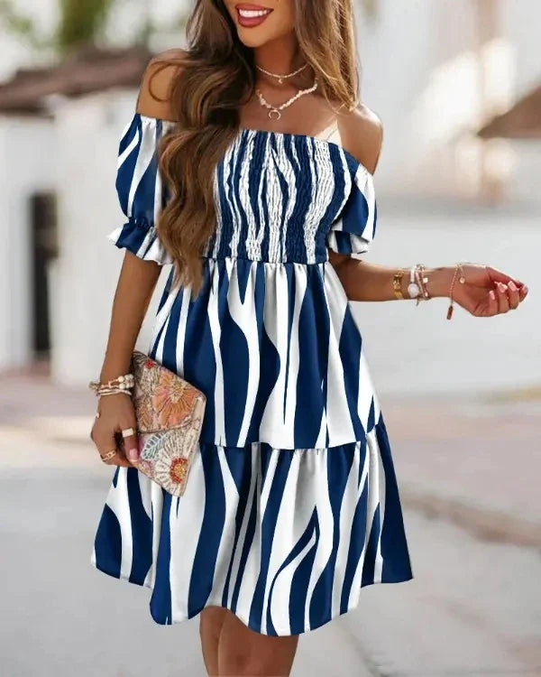 Matilda – Off-shoulder midi-jurk met bloemenprint en luchtige fit