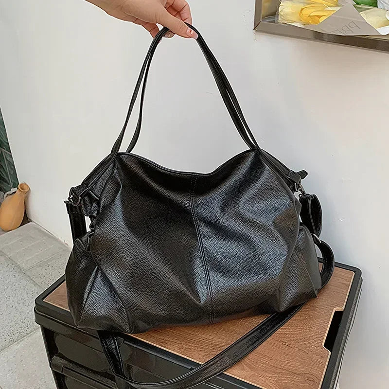 Elin – ruime retro schoudertas van pu-leer met crossbodyband