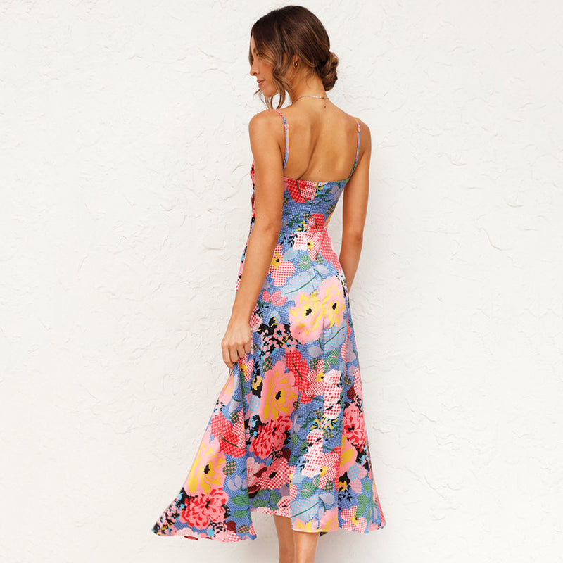 Ava – Zomer maxi bloemenjurk met verstelbare bandjes en elegante knoopdetails