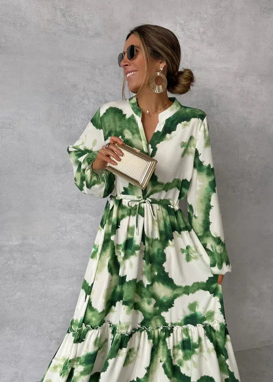 Amara – Terracotta maxi-jurk met etnische print en strikceintuur