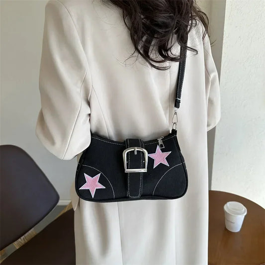 Tess – compacte schouder tas met star patroon en korte hengsels