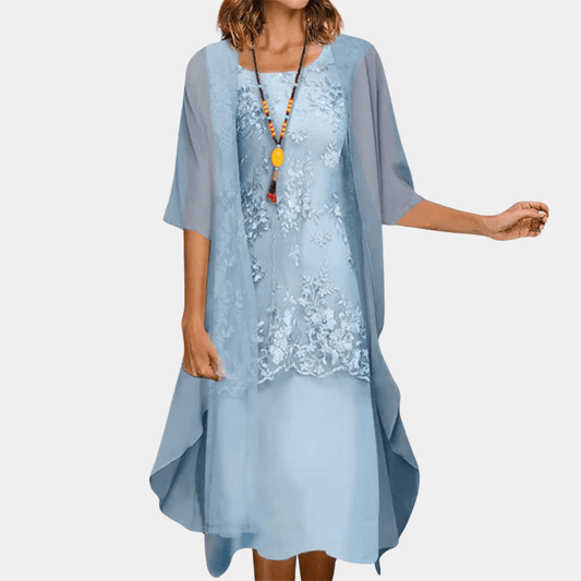 Nora – Effen damesjurk met bloemenkant smock taille
