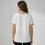 Dames top met V-hals en gouden randdetail