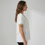 Dames top met V-hals en gouden randdetail