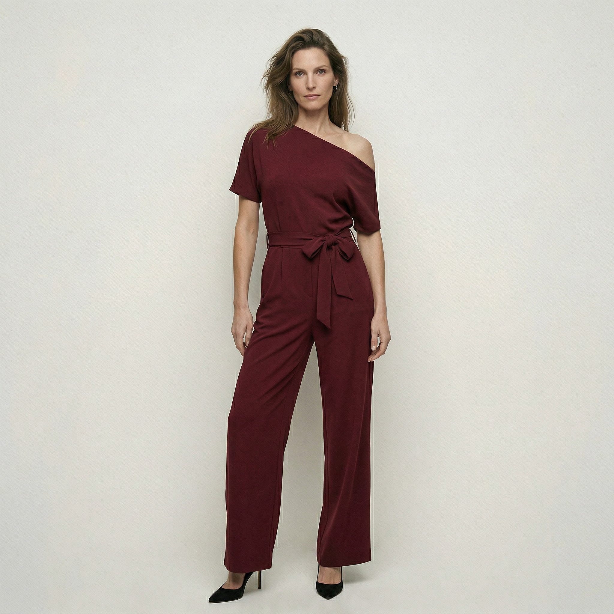 One shoulder jumpsuit met strikceintuur en wijde pijpen