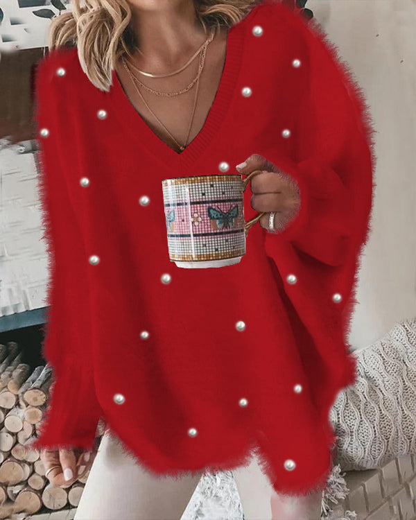 VALÉRIE – Zachte oversized trui met v-hals en pareldetails