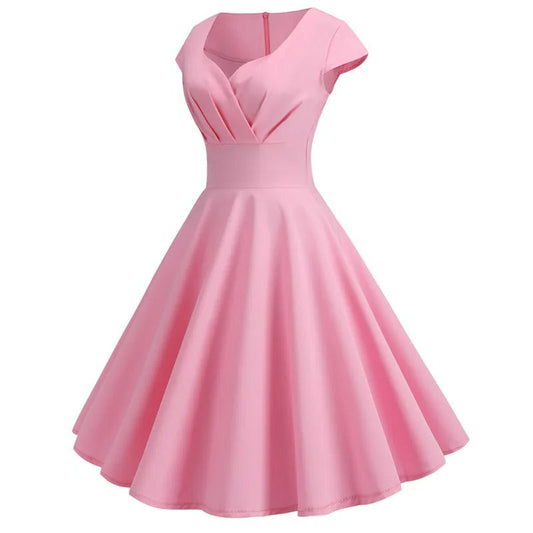 Liora – Koraalroze zomerjurk met V-hals en taille-accent